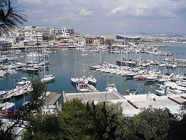 Two of the most popular landmarks of Piraeus, Mikrolimano and the Peace and Friendship Stadium, with the rest of Athens in the background