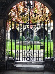 View through the gate into the Little Cloister, with St. Catherine's Chapel garden beyond