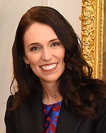 A smiling woman wearing a black dress