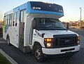 A 2008–present Ford E-Series STM bus used for the paratransit service.