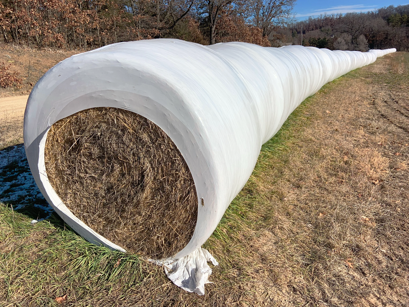 File:In-line bale wrapped hay.webp