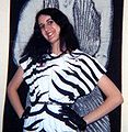 Girl in 1980 wearing a zebra-print top and short, black leather gloves, which shows the post-punk influence in the early years of the decade.