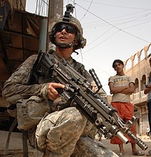 U.S. Army Spc. Joshua Rachal, from 2nd Platoon, Alpha Company, 1st Battalion, 502nd Infantry Regiment, 2nd Brigade Combat Team, 101st Airborne Division provides security, armed with an M249 squad automatic weapon during a patrol of the Hariyah district of Baghdad, Iraq, Aug. 30, 2008. (U.S. Army photo by Spc. Charles W. Gill/Released)