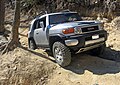 A Titanium Metallic FJ Cruiser negotiating an offroad trail at Uwharrie National Forest, NC (a couple of aftermarket parts are shown).