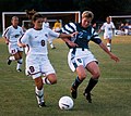 Image 7Mia Hamm (left) battles with German defender Kerstin Stegemann (from Women's association football)