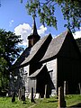 Lomen stave church during painting the summer of 2005