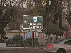 A rare button-copy Mexico Federal Highway 15 guide sign formerly located after the Mexico-U.S. border crossing in Heroica Nogales, Sonora, Mexico. Mexican highway signage generally has neither featured button-copy nor Highway-Gothic lettering on its highway signs.