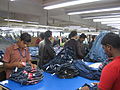 The final steps of preparing jeans for market.