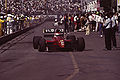 Emanuele Pirro driving for Scuderia Italia at the 1991 United States Grand Prix.