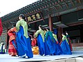 Models of gungnyeo, lady-in-waiting in green dangui