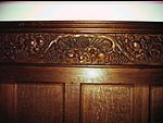 Carving of wheat and grapes in St John the Evangelist Church, Bury, Sussex.