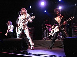 Left-to-right: Dan and Justin Hawkins and Frankie Poullain (obscured: Ed Graham), performing at Terminal 5 in New York on 21 October 2012