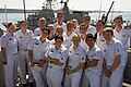 Men and women of the Royal Australian Navy in uniform V-necked shirts