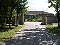 The green building beyond the entrance gate is the remnants of the SS troop barracks