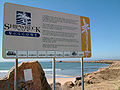 Sign at Stockton break wall, highlighting the shipwrecks on what was once a sandbar.