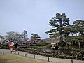 A couple admires the garden in April.