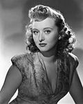 Black-and-white publicity photo of Celeste Holm .