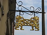 The pretzel has been in use as an emblem of bakers, here with two lions, in Görlitz, Germany