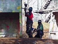 Paintball players, mid-game