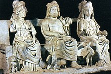 Statue of three figures, seated side by side