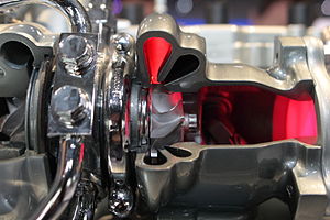 Cut-out of a twin-scroll turbocharger, with two differently angled nozzles