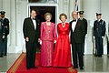 Ronald and Nancy Reagan with Margaret and Dennis Thatcher at the beginning of an official dinner at the White House, 1988.