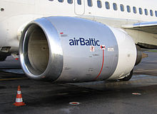 A close-up view of a CFM56-3 series engine mounted on a Boeing 737-500 showing flattening of the nacelle at the bottom of the inlet lip.