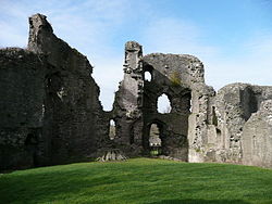 Interior of the surviving curtain wall and four-storey tower looking west from inside the castle grounds