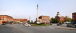 Downtown Angola's traffic circle (or roundabout), looking east. The monument in the center is dedicated to those who served in the American Civil War. The building with the cupola is the Steuben County courthouse, which is on the National Register of Historic Places.