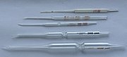 Carlsberg pipettes, glass micropipettes named for their place of invention and first use, The Carlsberg Laboratory, Physiology Department, Copenhagen, Denmark. Used with a mouthpiece for precision biochemical and physiological lab work. From the top: double constriction pipettes for 1 and 10 microlitres; single constriction pipettes for 200; 2,000; and 10,000 microlitres