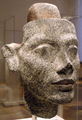 Granite head statue of Nefertiti. The securing post at head apex allows for different hairstyles to adorn the head. Altes Museum, Berlin.