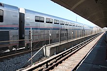 Silver railcars with many windows