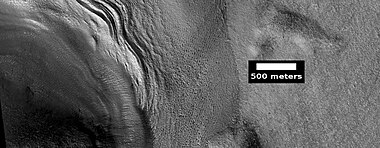 Close view of lobate debris apron around mesa, as seen by HiRISE under HiWish program Brain terrain is visible.