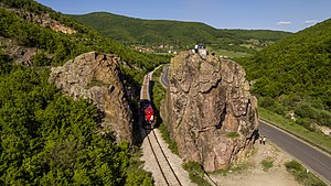 train passing the Guri i Plakës