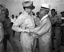 General Douglas MacArthur and Rhee Syngman, Korea's first President, warmly greet one another upon the General's arrival at Kimpo Air Force Base alt text