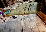 Players gathered around a table for a Dungeons and Dragons game session