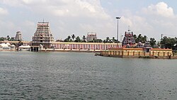 outer courtyard of a temple with two temple towers