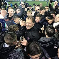 Photo of Vinny Perth, manager of Dundalk F.C. celebrating league title success