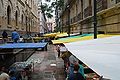 Informal old book market in a narrow alley.