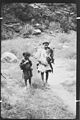 Urtsun (Utsun), Chitral, NWFP, Pakistan Kati boys, one dressed in a goat's skin with the typical Chitrali cap (pakol).