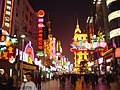 Neon lights in modern Shanghai show a predominance of red and yellow