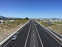 View of road lanes from over bridge.