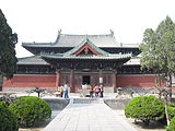 The Longxing Temple—built in 1052, located at present-day Zhengding, Hubei Province, China—has a hip-and-gable with double eaves.[5]