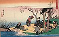 Hanami in Osaka. People enjoy viewing blossoms with dance, music, food and sake. The black box on the right is a multi-tiered bento box. Hiroshige(1834)