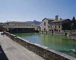 The bath and San Giovanni Battista church