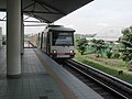 An Adtranz-Walkers EMU trainset (bearing the original STAR-LRT livery) arriving at the Bandar Tasik Selatan station.