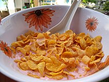 Corn flakes are usually served with cold milk (but sometimes with warm or hot). Fruit is a popular addition. Sugar may be added to taste.