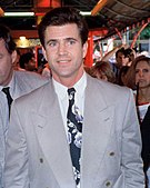 A man is seen wearing a grey suit