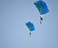 Members of the "BLUE WINGS" parachuting group from Romania descending to the harbour of Kavala (2013 AirSea Show)