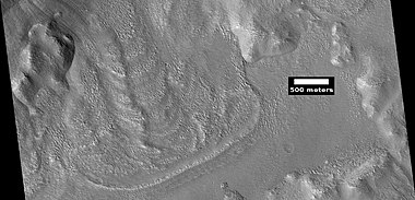 Glacier coming out of valley, as seen by HiRISE under HiWish program. Location is rim of Moreux Crater. Location is Ismenius Lacus quadrangle.